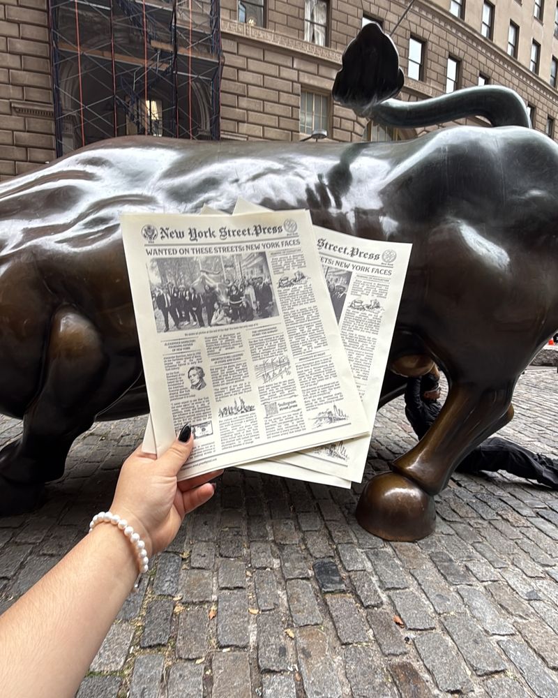 An FMA member at the Charging Bull on Wall Street, 2025